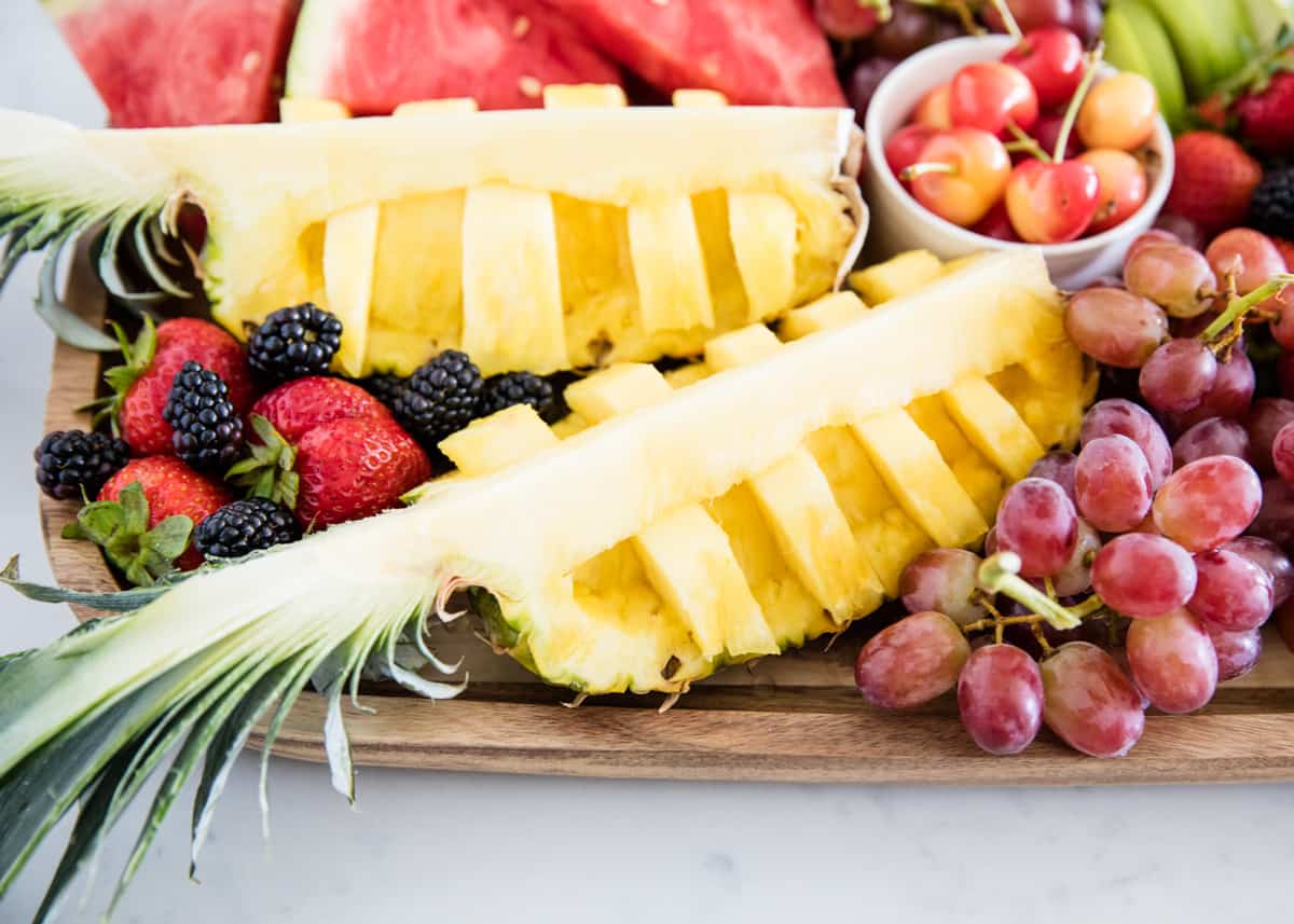 Cut pineapple on fruit board.