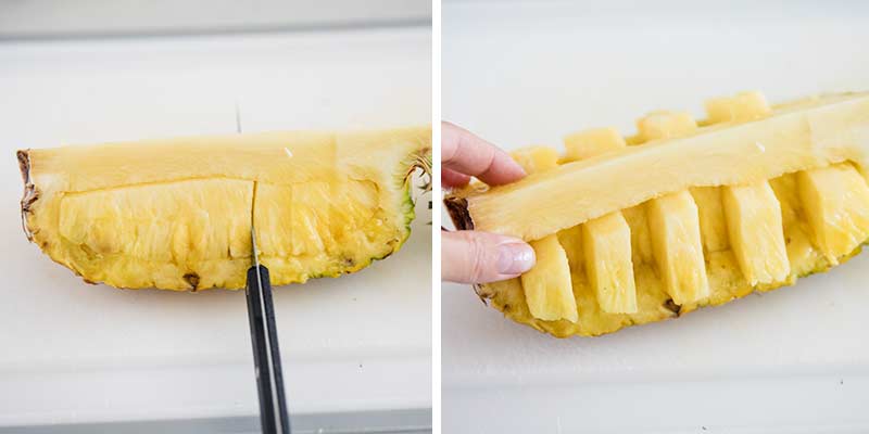 Slicing pineapple on cutting board.