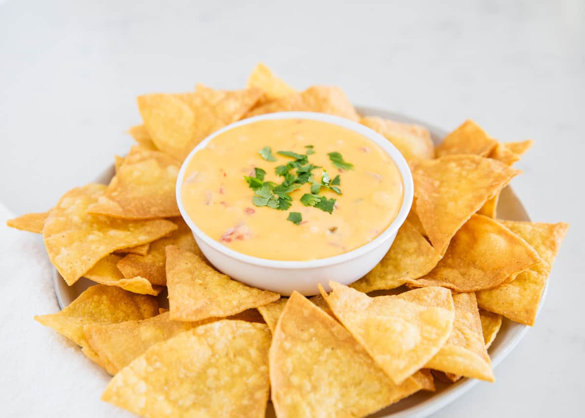 Bowl of Velveeta queso served with tortilla chips.