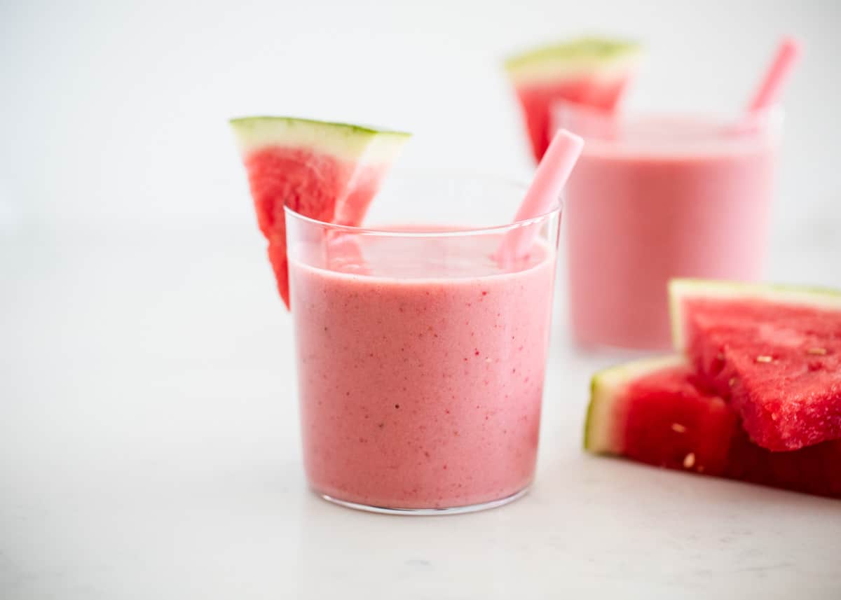 This watermelon smoothie is the perfect drink on a hot summer day! It's cold, creamy, naturally sweet and super refreshing. It has the perfect amount of watermelon flavor. Watermelon smoothie glass cup.
