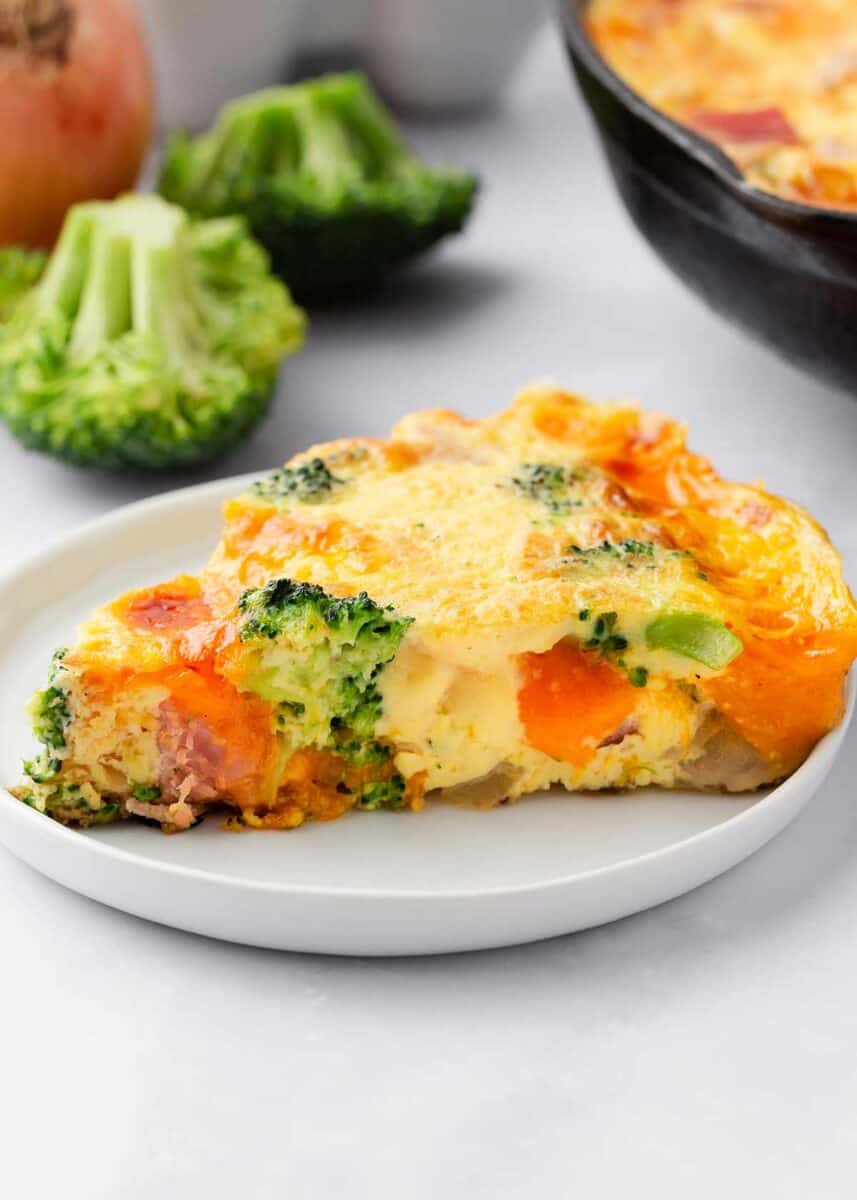 Slice of frittata on a white plate.