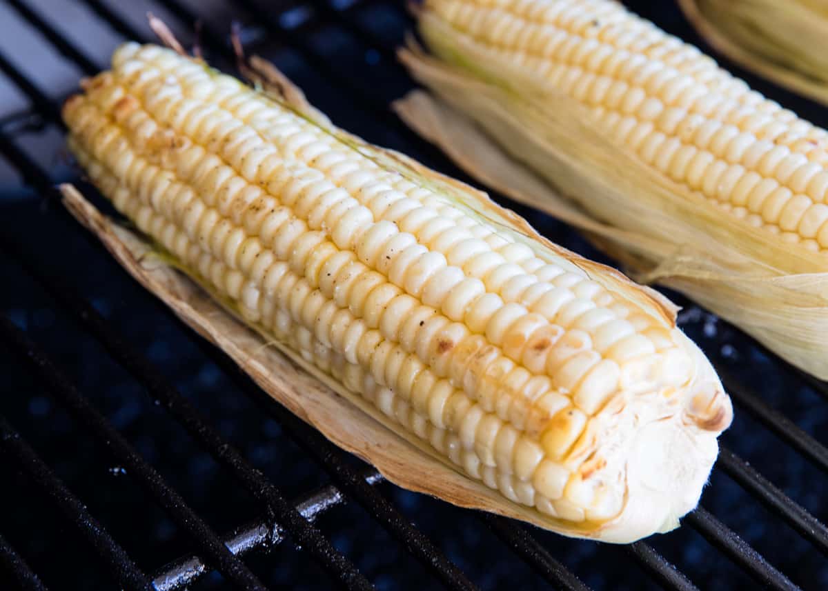 Grilling corn in the husk.
