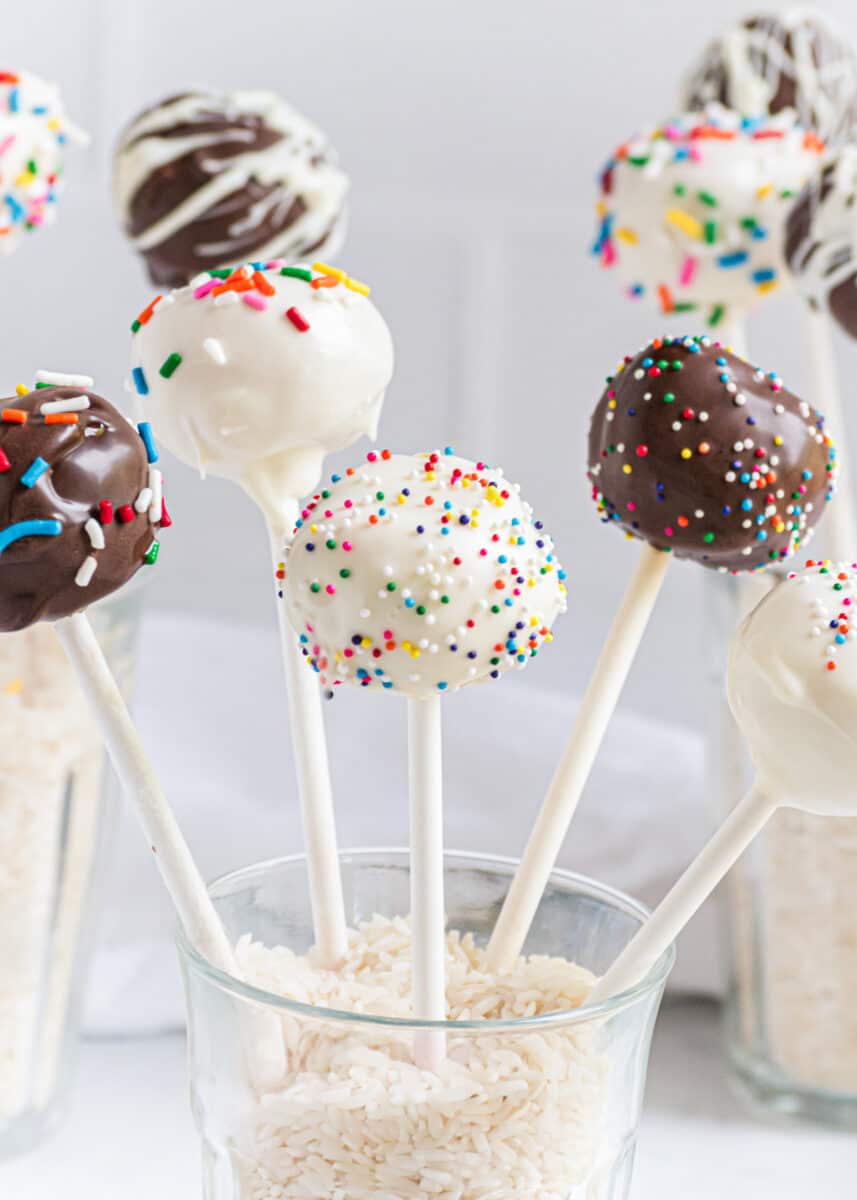 cake pops standing in cup with rice