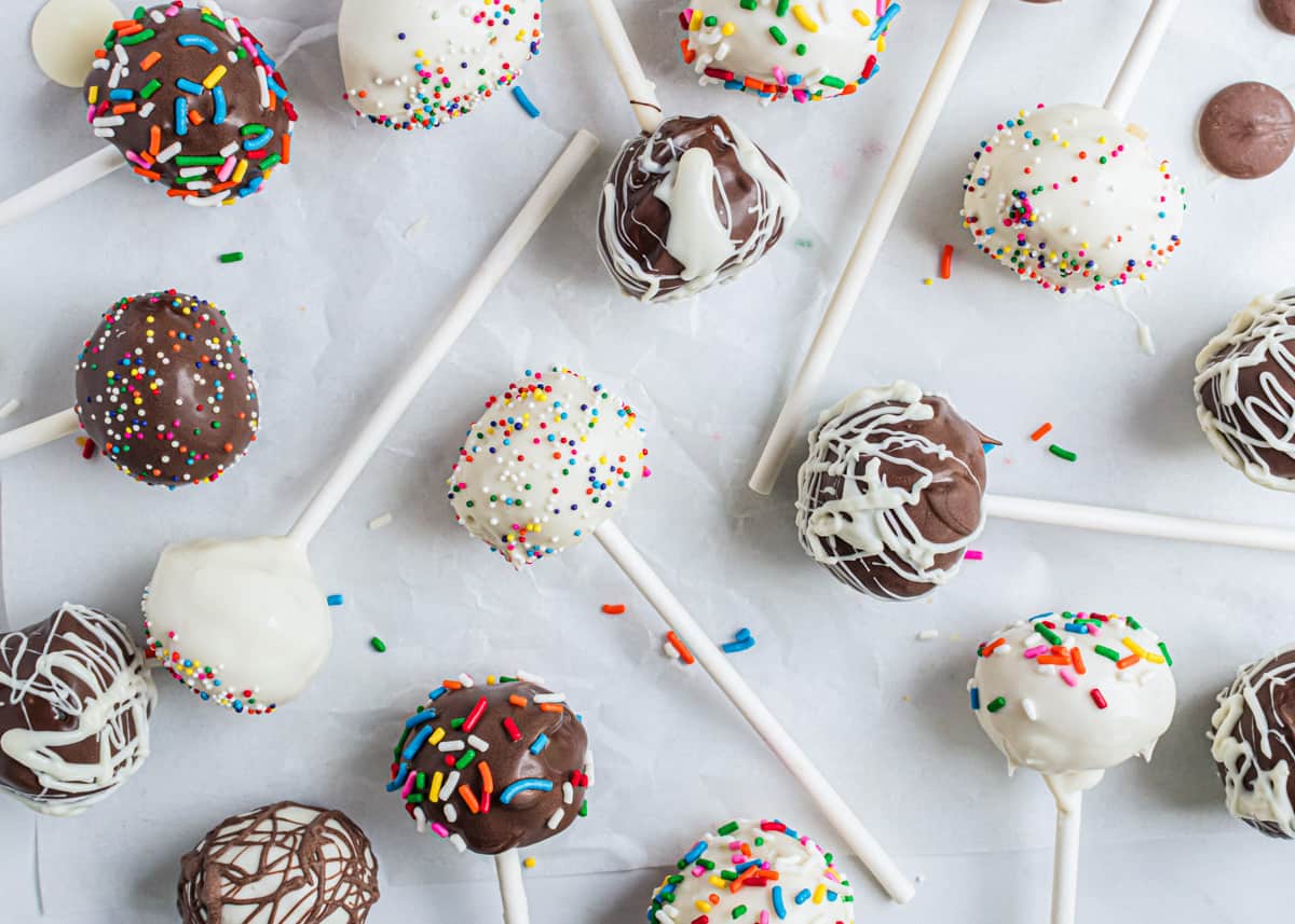 Cake pops laying on parchment paper.