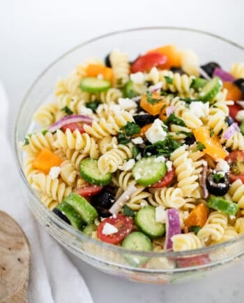 greek pasta salad in a glass bowl