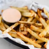 Homemade french fries in a basket.