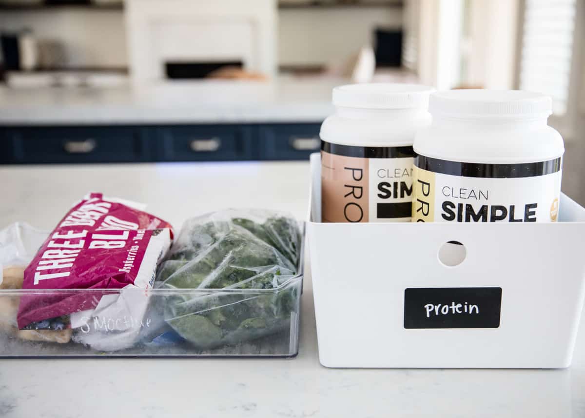 Protein powder in basket on counter. 