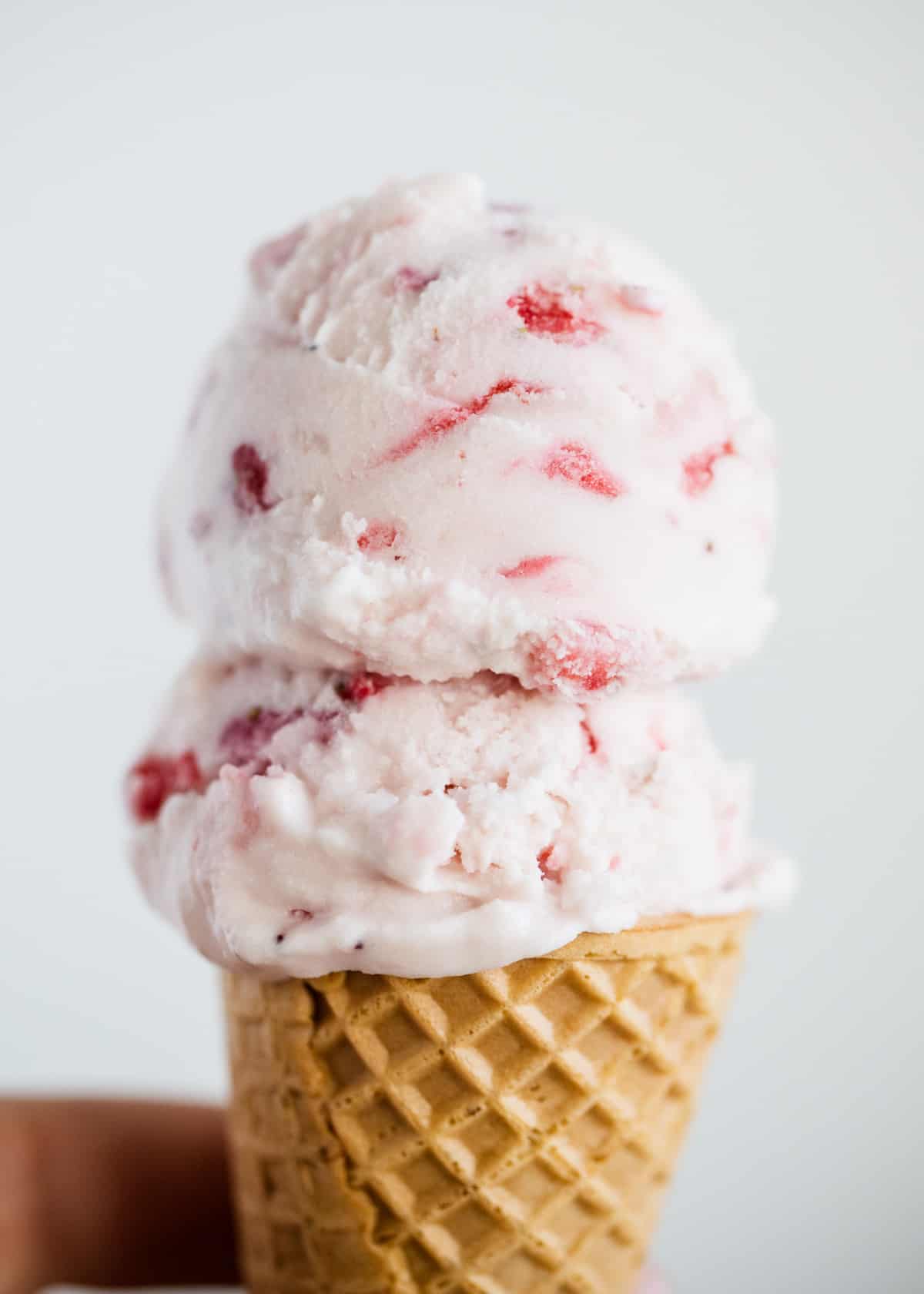 Strawberry ice cream in cone.