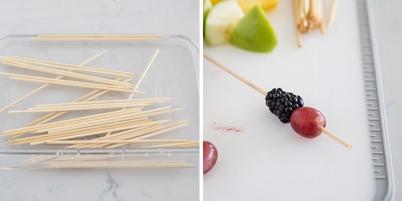 Placing fruit on wooden skewers.