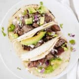 steak tacos on white plate