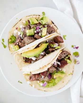 steak tacos on white plate