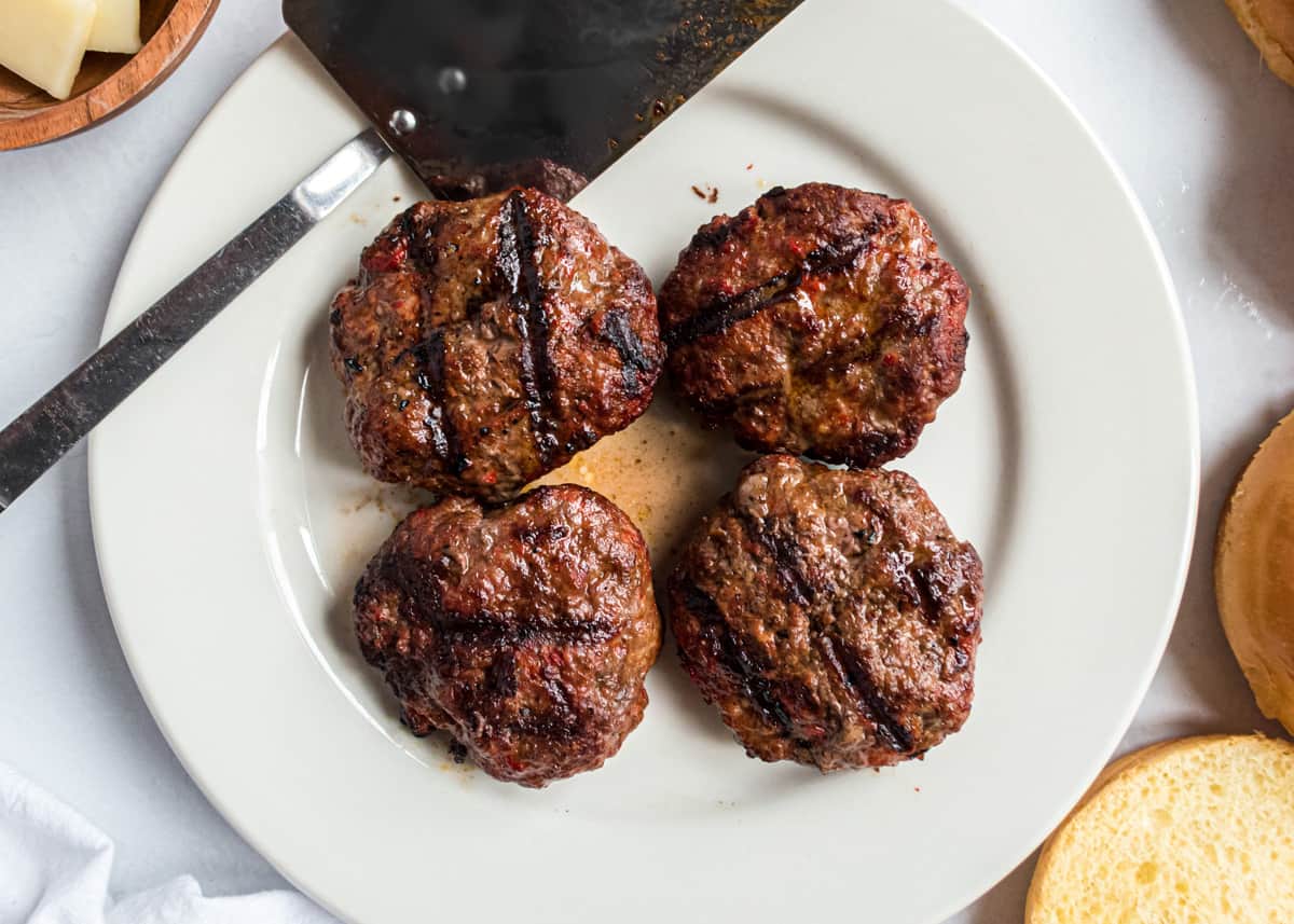 Italian burgers on white plate.