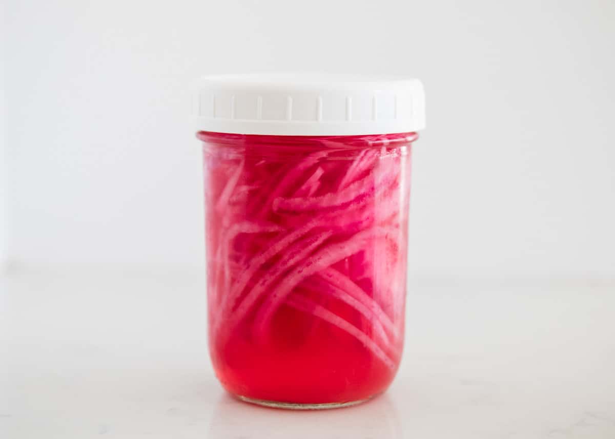 Pickled onions in a jar.