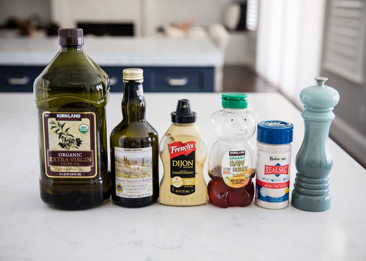 Balsamic dressing ingredients lined up on counter.
