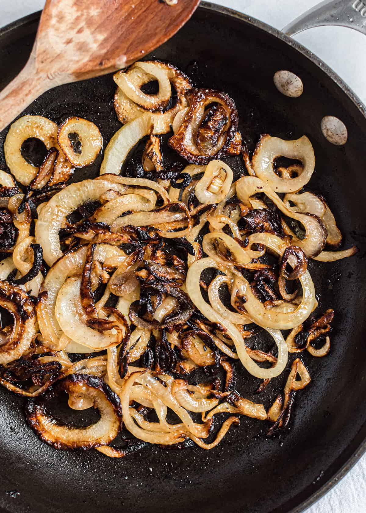 Caramelized onions in black skillet.