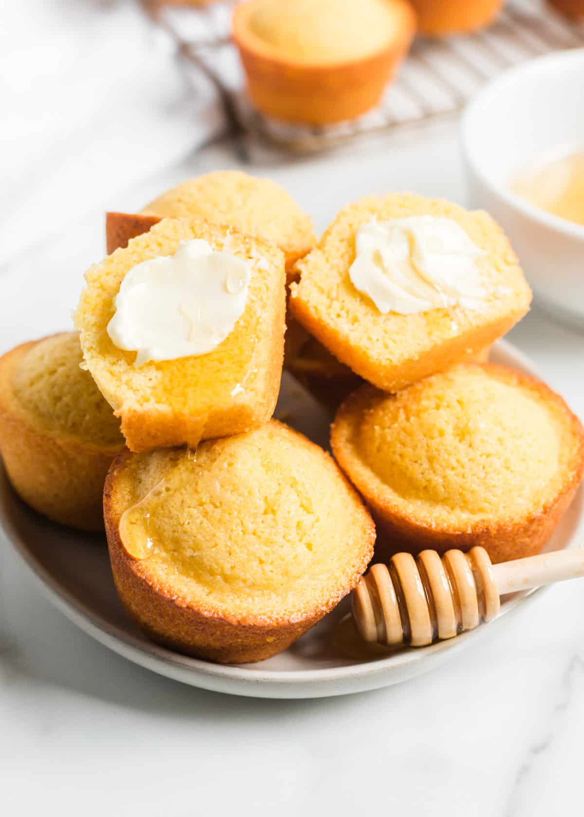 Cornbread muffins on white plate.