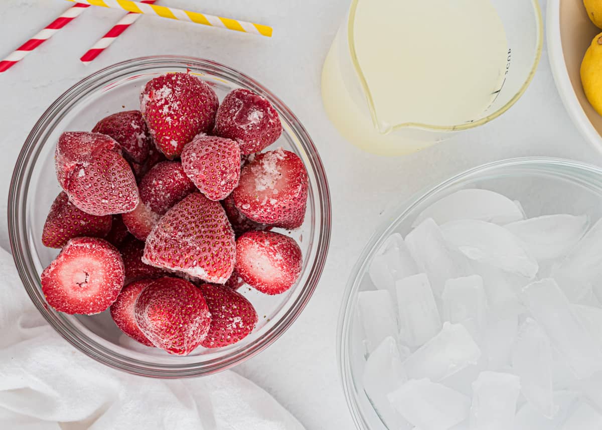 Strawberry lemonade ingredients on counter.