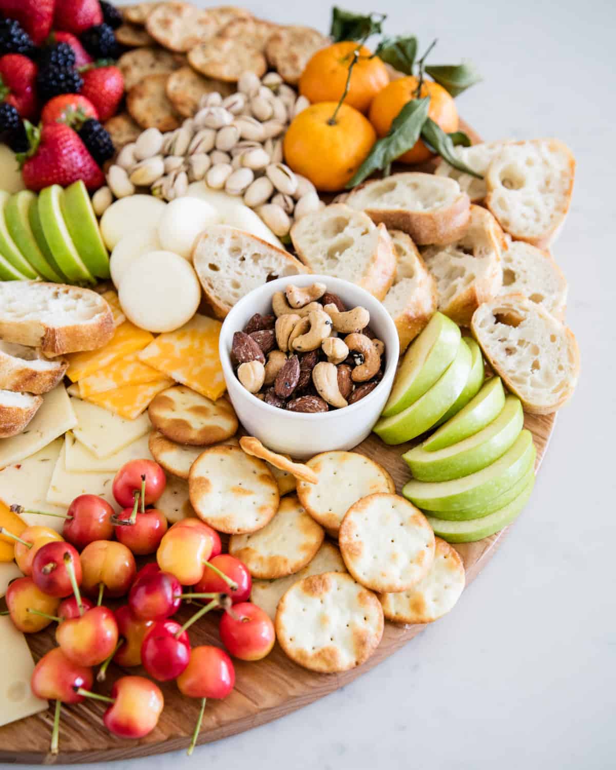 Nuts, fruit, cheese, and crackers are on board.