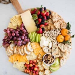 fruit and cheese platter on circle board