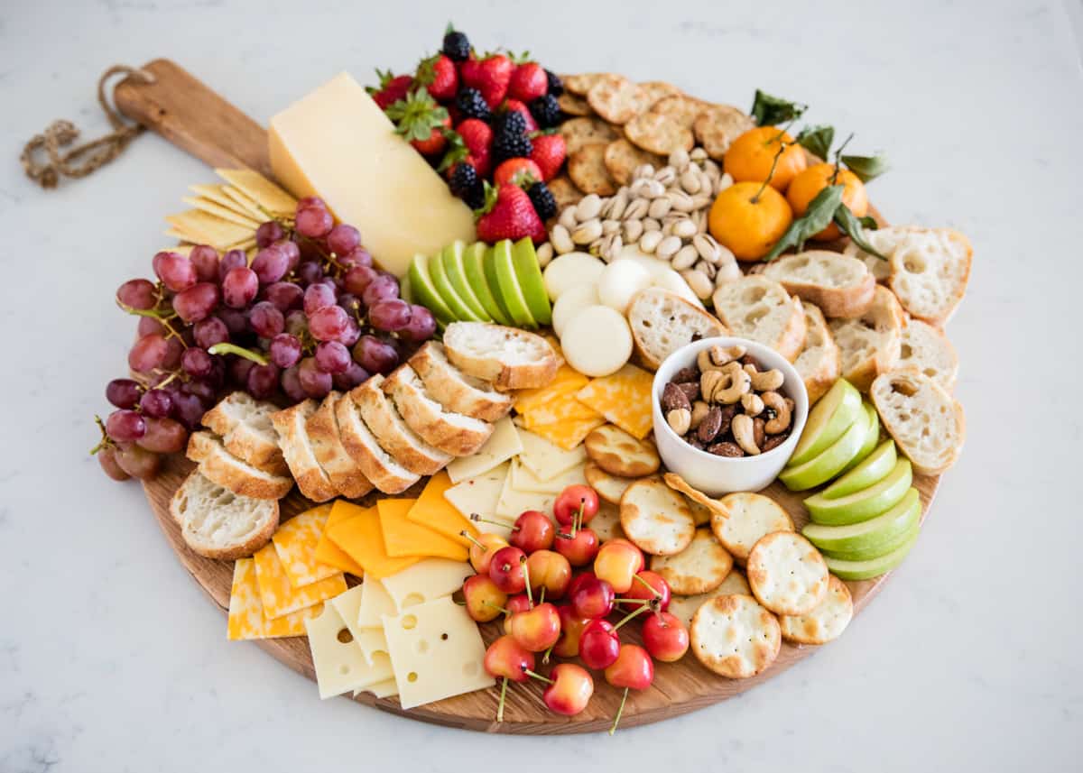 Fruit and cheese tray on counter.