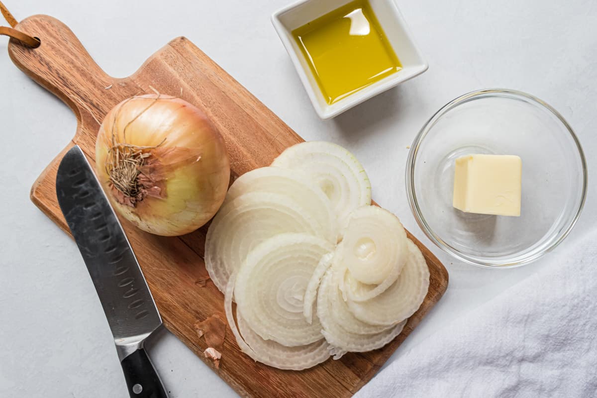 Sliced onion on cutting board.