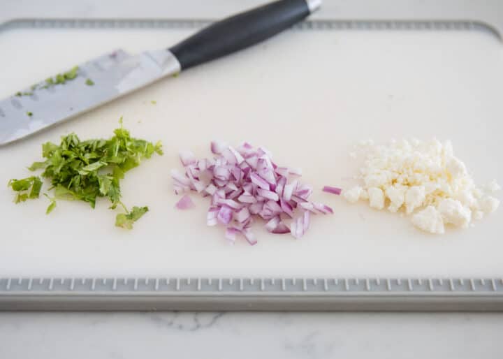 taco toppings on cutting board