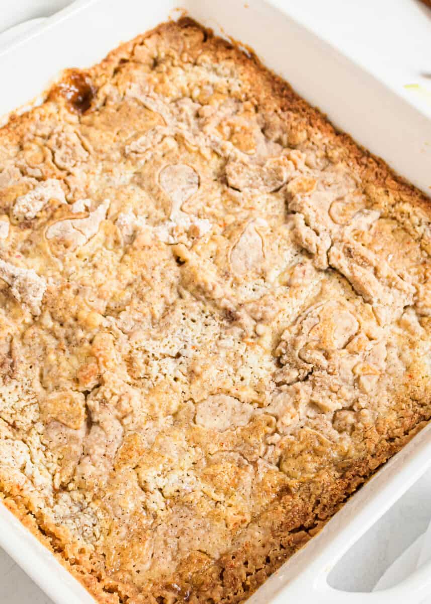 Easy apple dump cake in a white baking dish.
