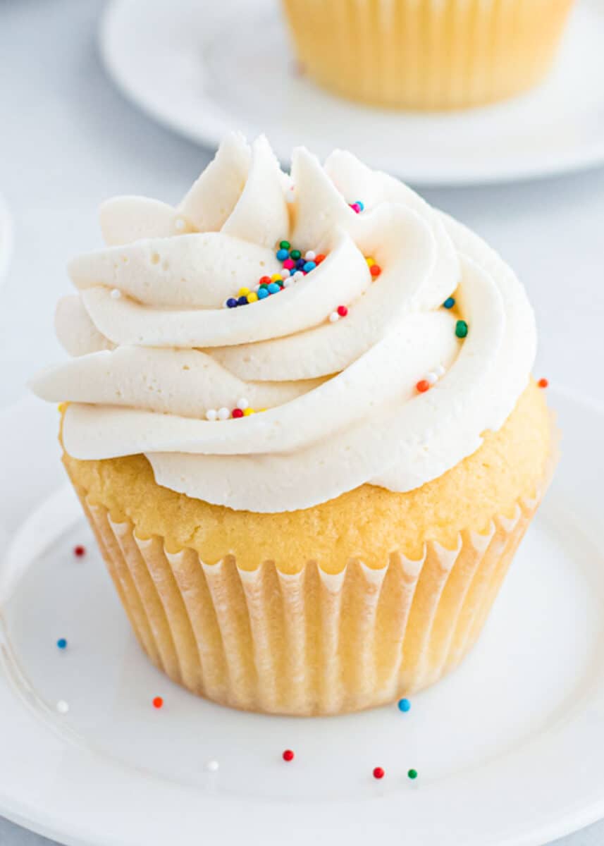 Buttercream frosted on a vanilla cupcake.