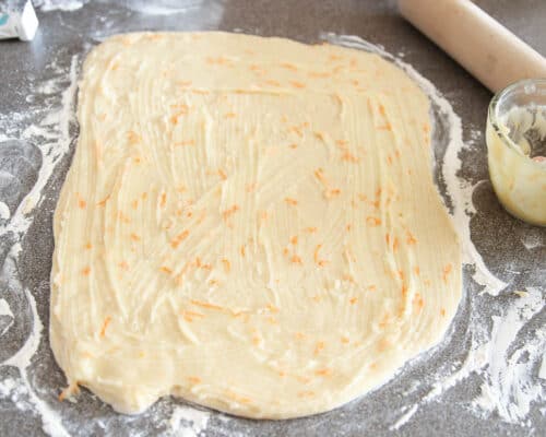orange roll dough on counter