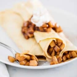 Apple crepes on a plate.