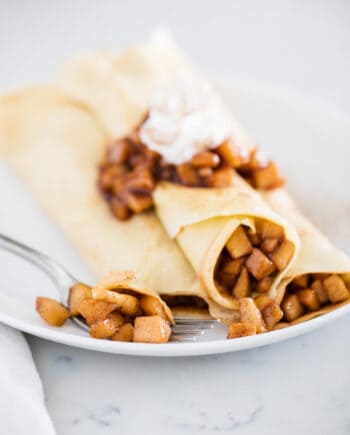 Apple crepes on a plate.