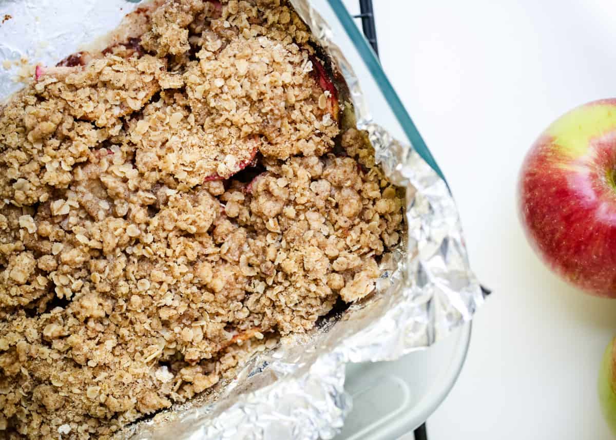 Apple pie bars in a foil lined baking dish.