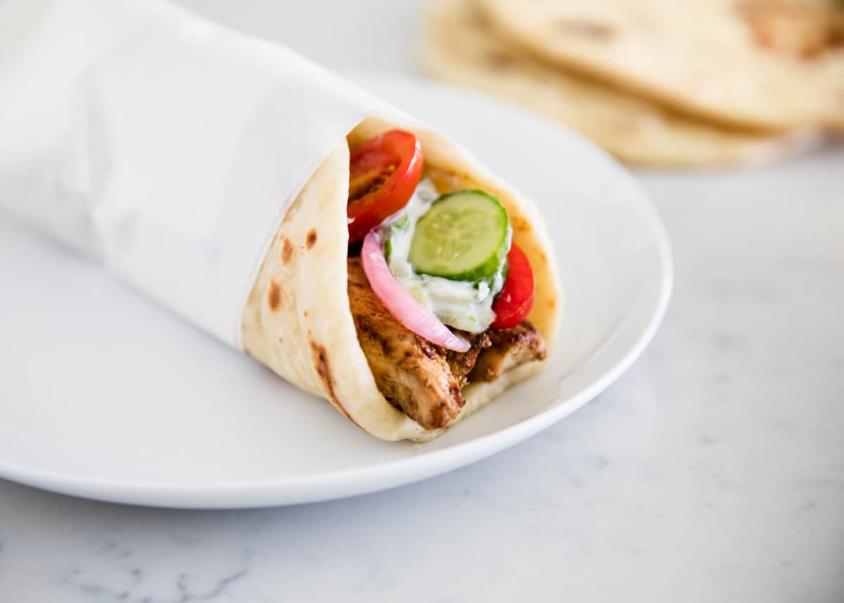Chicken gyro wrapped on plate.