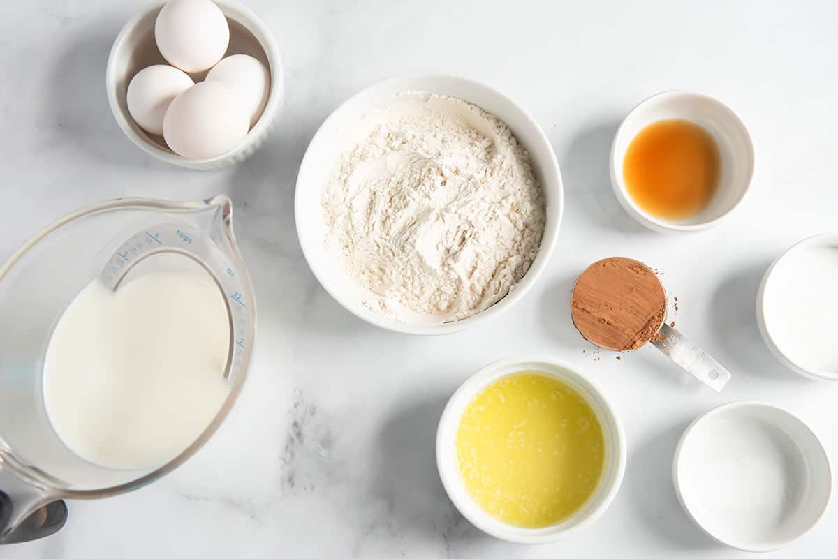 Chocolate crepe ingredients on counter.