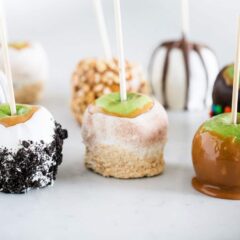 Homemade caramel apples on the counter.