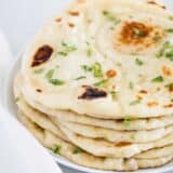 stacked naan bread on plate