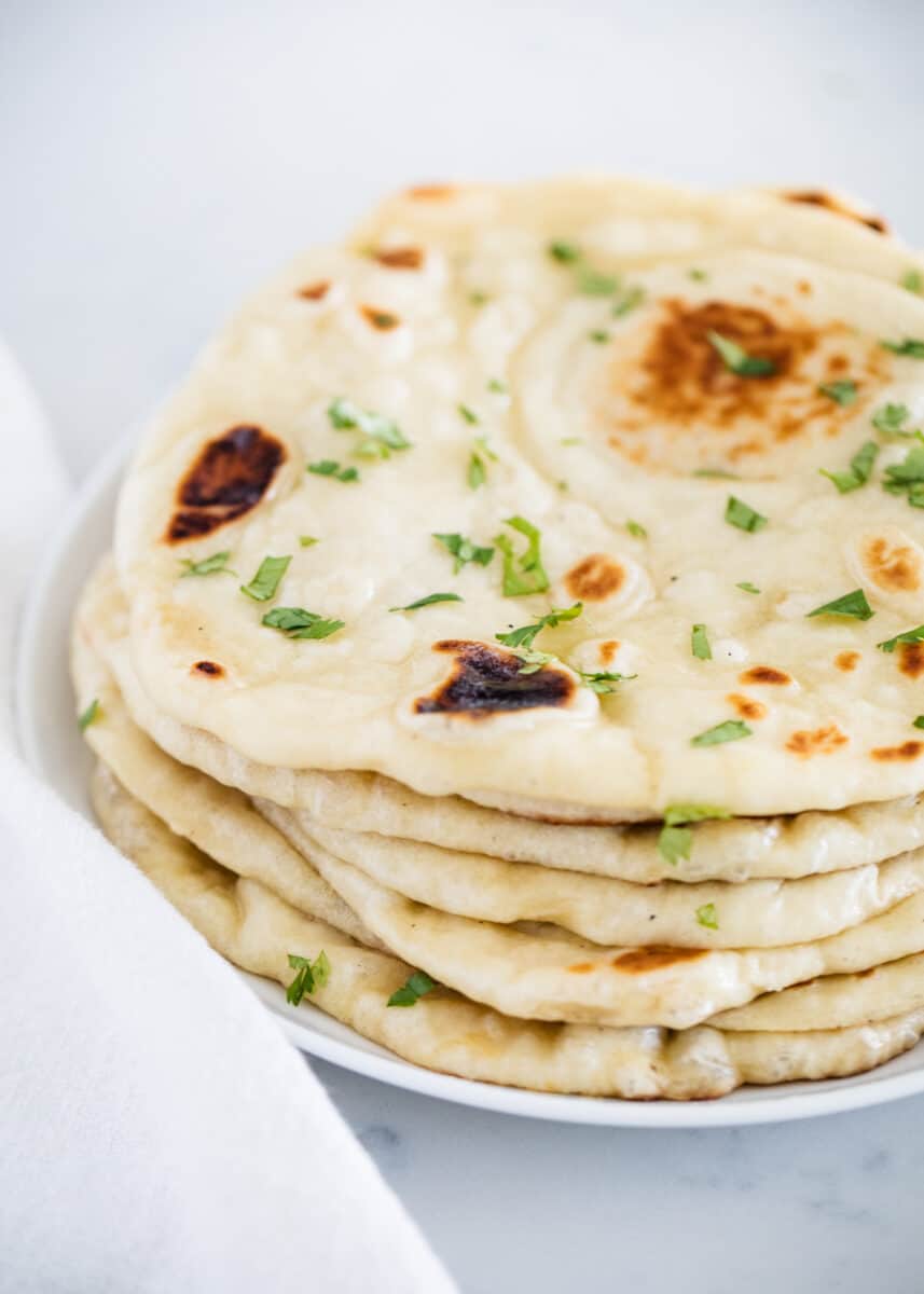 stacked naan bread on plate