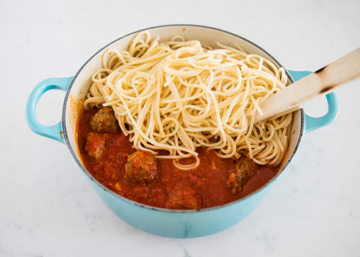 Spaghetti and meatballs in pot.