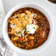Chili in white bowl on counter