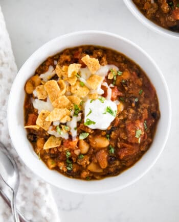 Chili in white bowl on counter