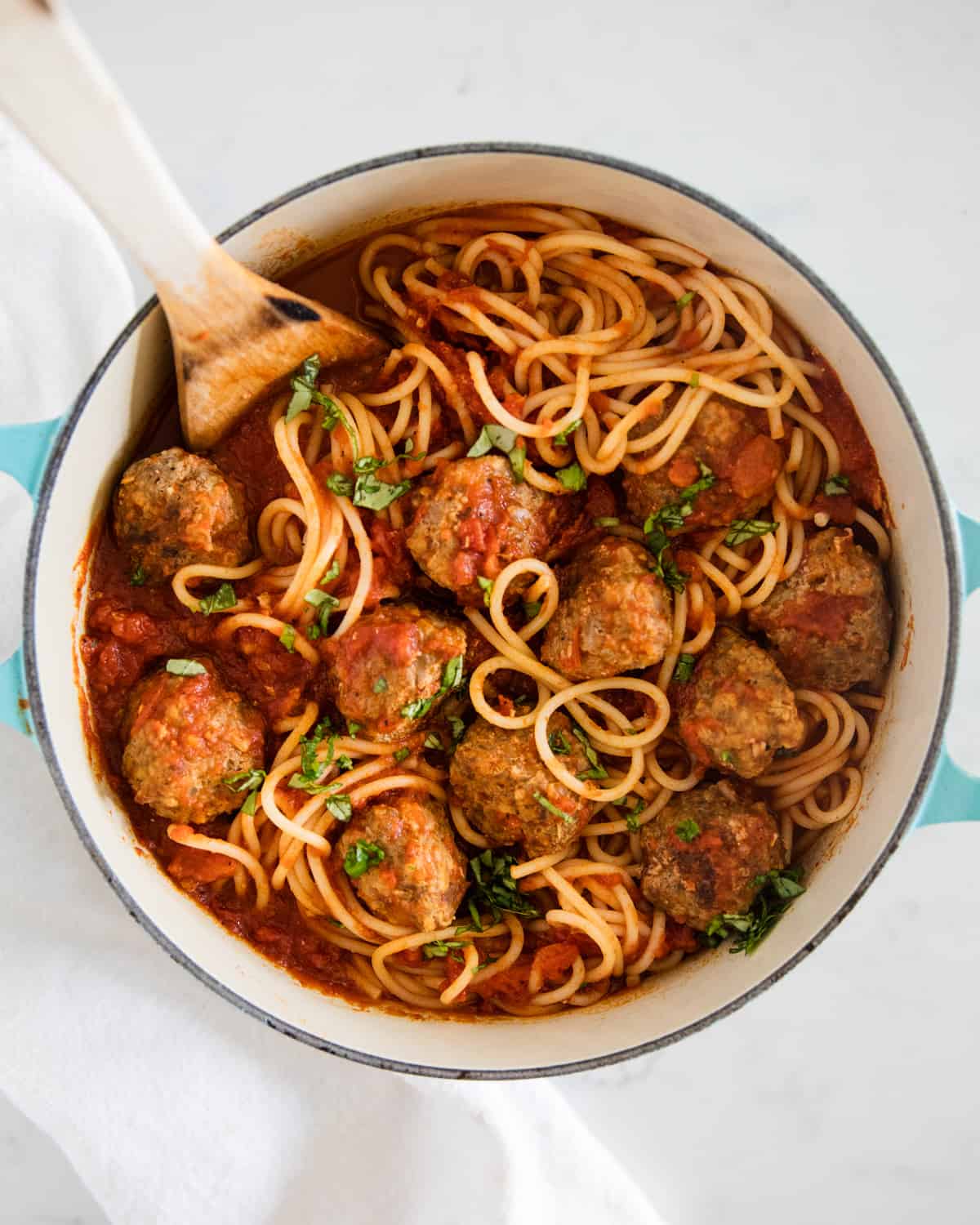 Spaghetti and meatballs in pot.