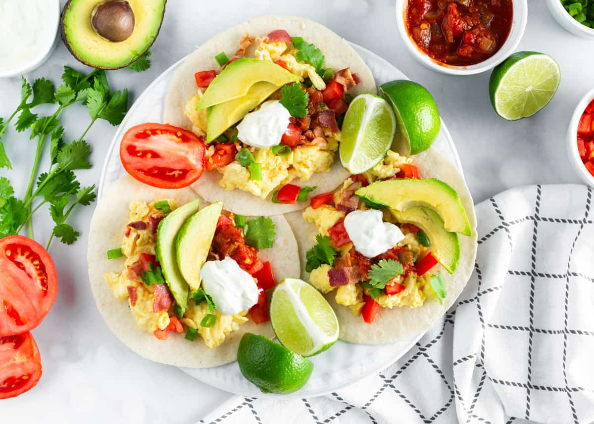 Plate full of breakfast tacos.