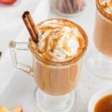 glass cup with caramel apple cider and cinnamon