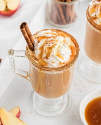 glass cup with caramel apple cider and cinnamon