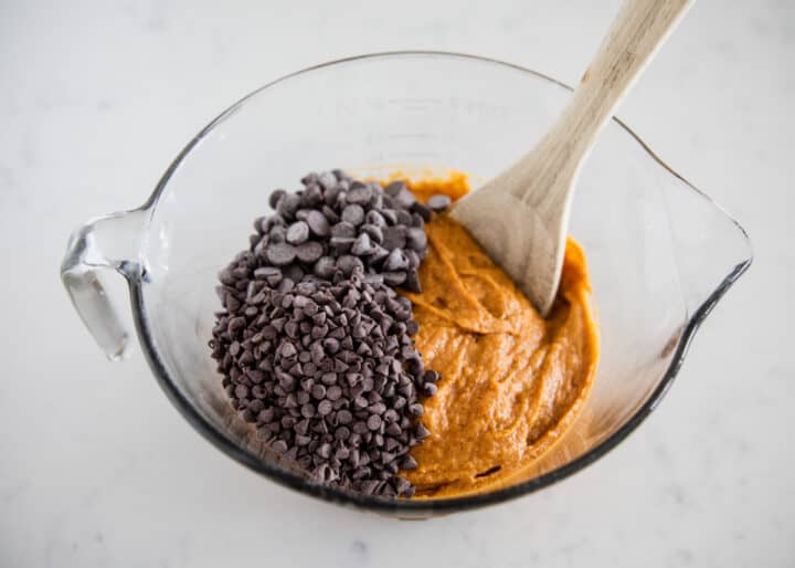 pumpkin muffin batter in bowl with chocolate chips