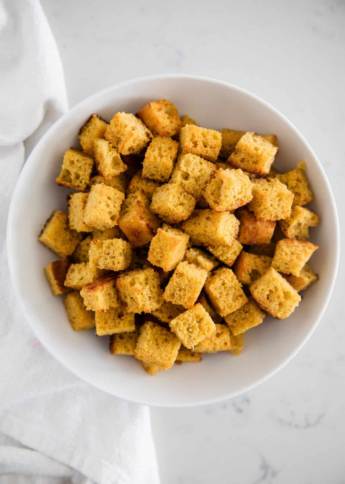 This cornbread recipe makes a large pan of cornbread, perfect for feeding a group or for leftovers. Recipes Using Leftover Cornbread - 2 Ingredient Cornbread Croutons I Heart Naptime
