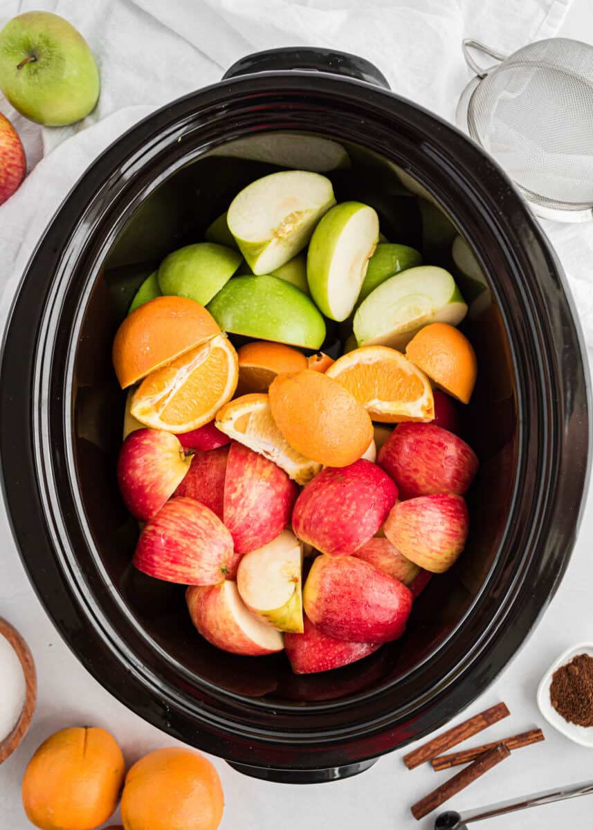 crockpot full of apples and oranges