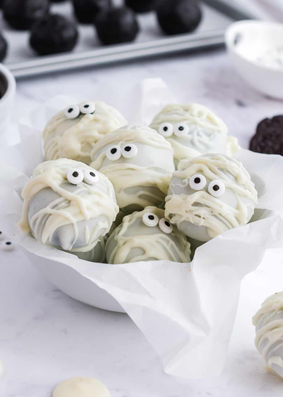 Mummy oreo balls in bowl.