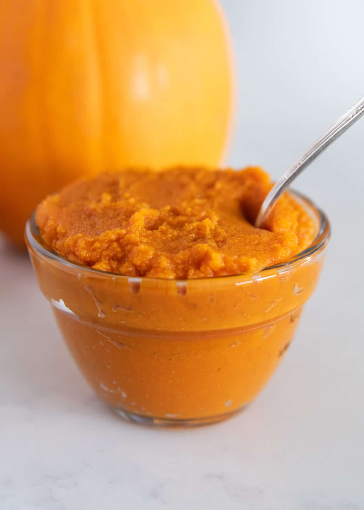 Pumpkin puree in glass bowl.