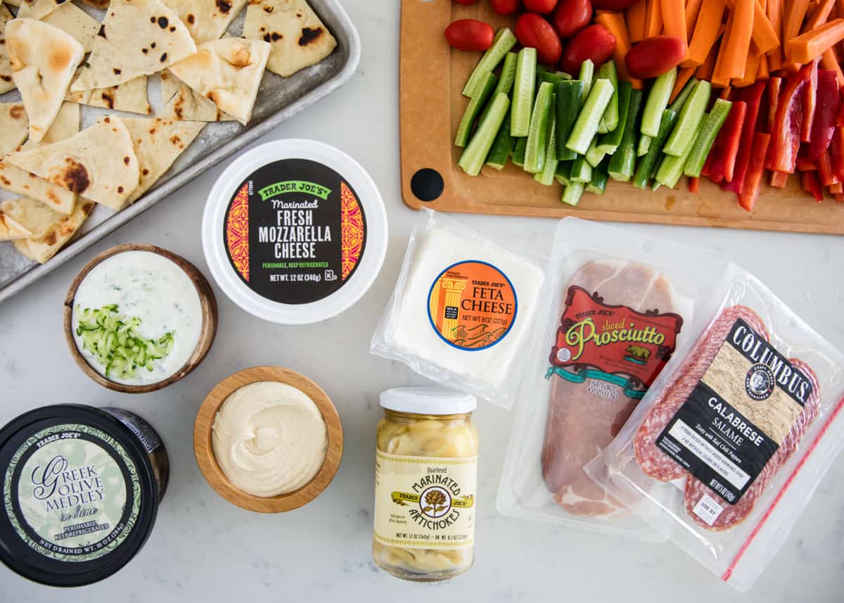 Mezze platter ingredients on counter.